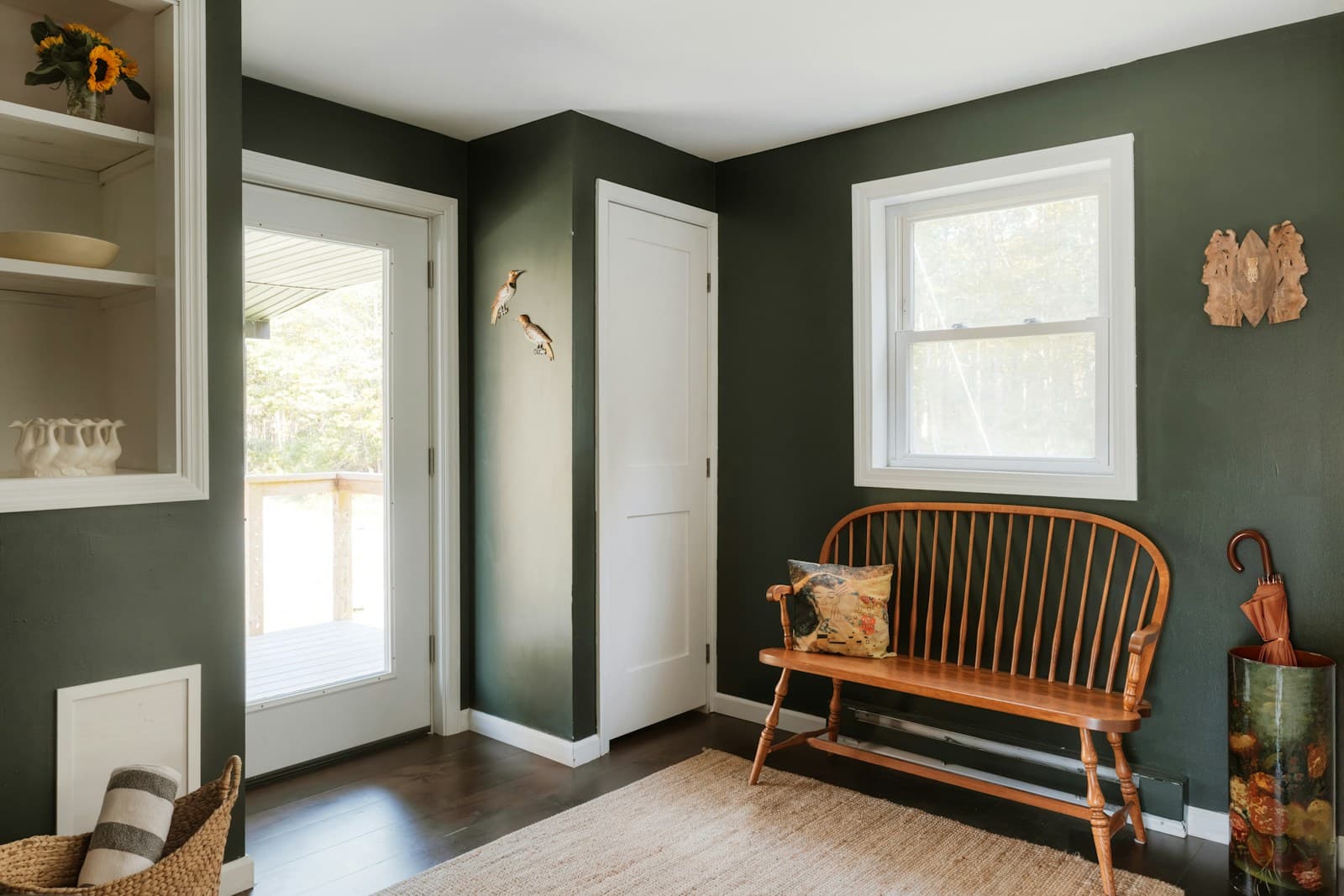 An organized entryway with a bench and built-in shelving